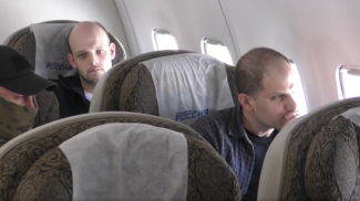 Screenshot of the video by Russia’s FSB, from the cabin of the plane during the flight from Moscow to Türkiye . The footage shows the exchanged Gershkovich and Krieger