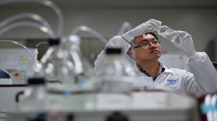 An engineer checks the efficacy of a medicine at a research facility of Innovent Biologics Inc in Suzhou, Jiangsu province