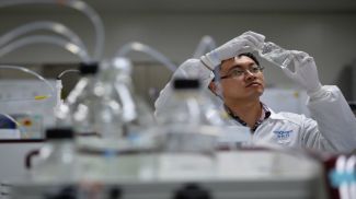 An engineer checks the efficacy of a medicine at a research facility of Innovent Biologics Inc in Suzhou, Jiangsu province