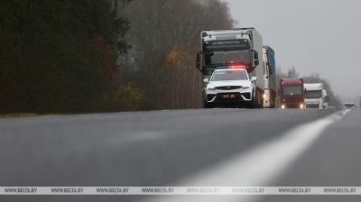 Lithuanian trucks escorted by traffic police to designated parking areas