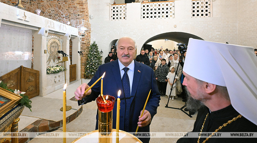 Lukashenko lights candle in church on Christmas