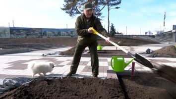 Lukashenko works at the site of the National History Museum during a community clean-up day