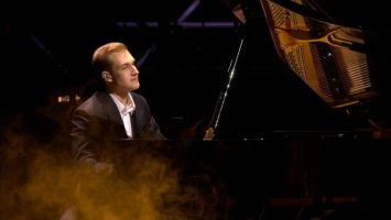 Nikolai Lukashenko plays piano piece at patriotic forum in Minsk